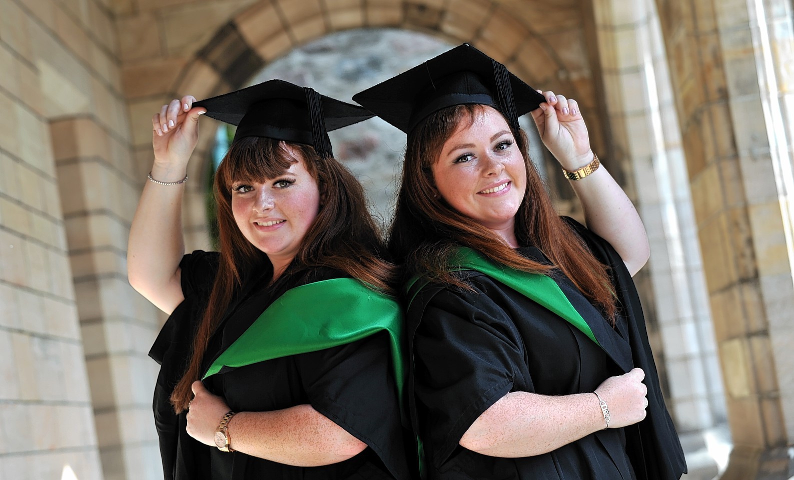 Twins Graduate In Sync