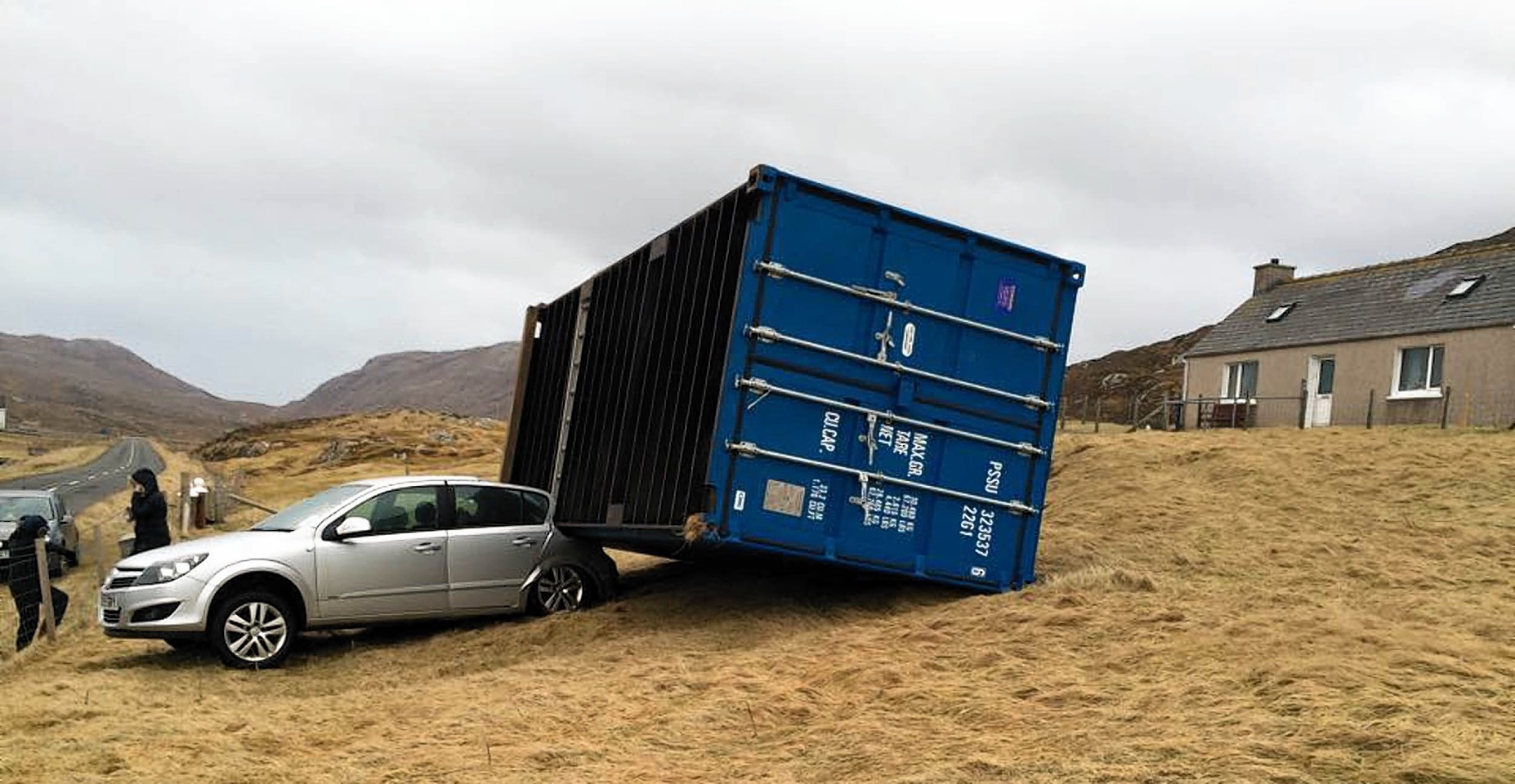 Ouch! Wind smashes shipping container into car on Scottish island 