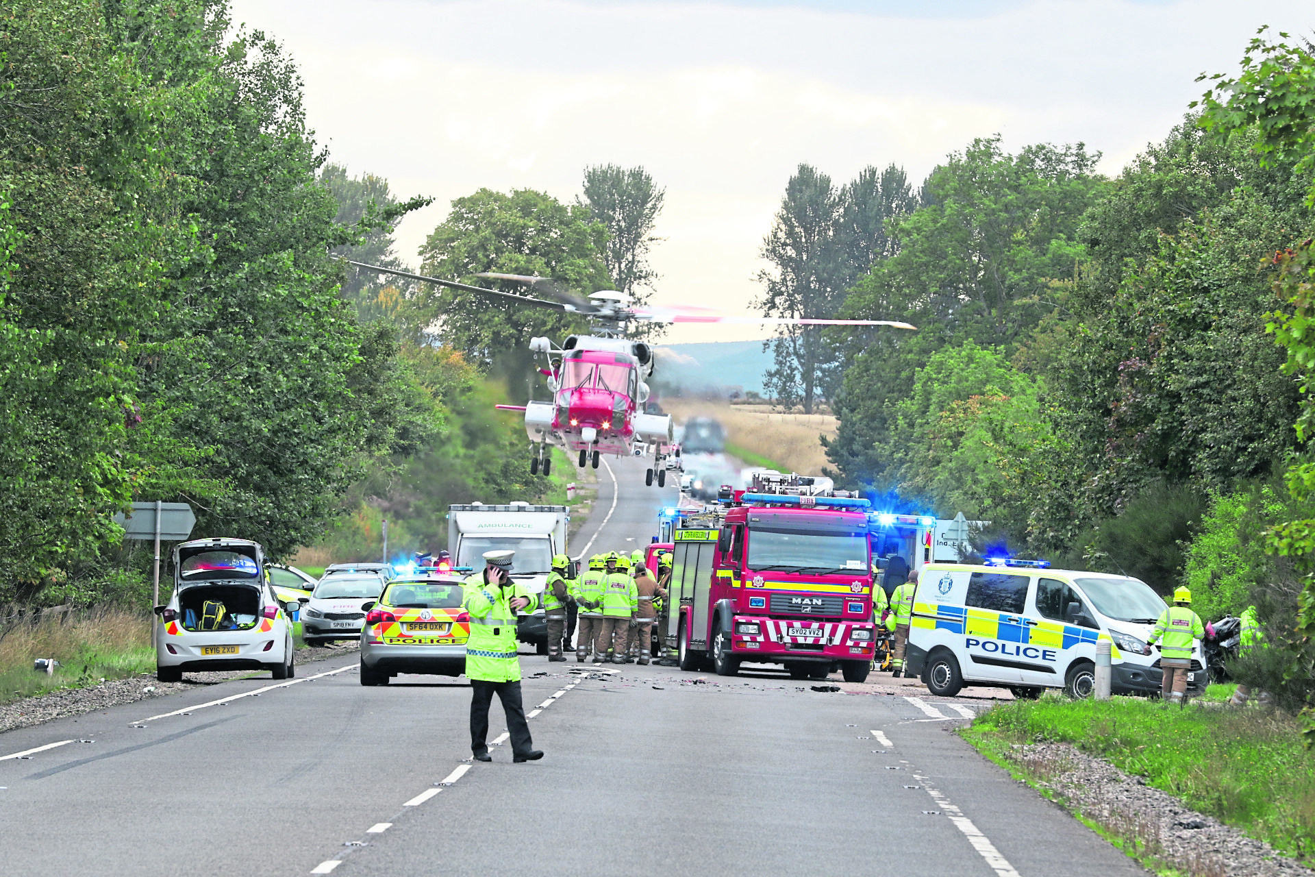 Two vehicle crash involving police car leaves three injured in